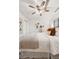 Bright bedroom with a ceiling fan, wooden floors, a big bed and lots of light at 1223 Race St # 101, Denver, CO 80206