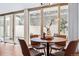 Dining area with a wooden table, four chairs, and sliding glass doors to a patio at 1223 Race St # 101, Denver, CO 80206