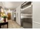 Building lobby featuring two stainless steel elevators and tiled floor at 1223 Race St # 101, Denver, CO 80206