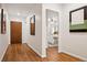 Hallway view featuring hardwood floors, natural light, and neutral wall colors at 1223 Race St # 101, Denver, CO 80206