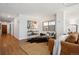 Spacious living room featuring wood floors, modern decor, and a large window for natural light at 1223 Race St # 101, Denver, CO 80206