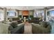 Relaxing living room with comfortable sofas, brick fireplace and floor to ceiling windows at 1223 Race St # 101, Denver, CO 80206
