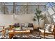 Relaxing covered patio area with stylish furniture and cozy atmosphere at 1223 Race St # 101, Denver, CO 80206