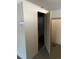 Image of a utilitarian storage area with an open door and basic shelving within at 1223 Race St # 101, Denver, CO 80206