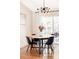 Cozy dining area features a modern light fixture and sliding glass doors to the outdoor deck at 11647 E Wesley Ave, Aurora, CO 80014