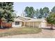 Charming single-Gathering home with a well-manicured lawn, covered entryway, and mature trees at 11647 E Wesley Ave, Aurora, CO 80014