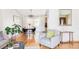 Open living area with hardwood floors that flows into the dining area with stylish furnishings at 11647 E Wesley Ave, Aurora, CO 80014