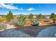 Landscaped backyard with gravel pathway and mountain views at 3338 Youngheart Way, Castle Rock, CO 80109