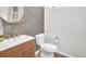 Stylish powder room with floral wallpaper and modern vanity at 3338 Youngheart Way, Castle Rock, CO 80109