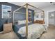 Main bedroom with a gold canopy bed and sitting area at 3338 Youngheart Way, Castle Rock, CO 80109