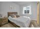 Bedroom with wood platform bed and large window at 3338 Youngheart Way, Castle Rock, CO 80109