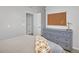 Bedroom with gray dresser and striped bedding at 3338 Youngheart Way, Castle Rock, CO 80109