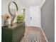 Bright entryway with a console table, mirror, and patterned rug at 3338 Youngheart Way, Castle Rock, CO 80109
