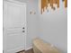 Inviting entryway with a bench and wood accent wall at 3338 Youngheart Way, Castle Rock, CO 80109