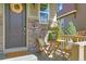 Small front porch with a table and chairs for relaxing at 3338 Youngheart Way, Castle Rock, CO 80109