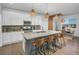 Modern kitchen with white cabinets, granite countertops, and an island at 3338 Youngheart Way, Castle Rock, CO 80109
