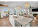 Open concept kitchen and dining area with granite countertops at 3338 Youngheart Way, Castle Rock, CO 80109