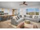 Open concept kitchen and living area with modern appliances and island at 3338 Youngheart Way, Castle Rock, CO 80109
