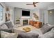 Living room with a fireplace and a view, featuring a sectional sofa at 3338 Youngheart Way, Castle Rock, CO 80109