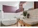 Bathroom boasting a double sink vanity, soaking tub and modern fixtures at 3559 Hudson St, Denver, CO 80207