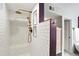 Shower stall featuring white subway tile, bench and copper shower head at 3559 Hudson St, Denver, CO 80207
