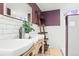 Charming bathroom featuring a double sink vanity, subway tile backsplash and neutral paint at 3559 Hudson St, Denver, CO 80207