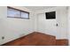 Bedroom with hardwood floors, and television at 3559 Hudson St, Denver, CO 80207