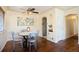 Cozy dining room with hardwood floors, a ceiling fan, and a round table with modern chairs at 3559 Hudson St, Denver, CO 80207