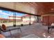 Relaxing covered patio with stone pavers and backyard views at 3559 Hudson St, Denver, CO 80207