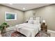 Cozy bedroom with large window, hardwood floors and modern decor at 20033 Silver Ranch Rd, Conifer, CO 80433