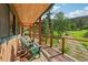 Charming porch with wooden flooring and seating, perfect for relaxing and enjoying the view at 20033 Silver Ranch Rd, Conifer, CO 80433