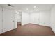Finished basement area with neutral carpet and white walls at 2748 S Kenton Ct, Aurora, CO 80014