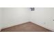 Small basement room with neutral carpet and one small window at 2748 S Kenton Ct, Aurora, CO 80014