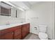 Full bathroom showcasing a dual sink vanity and a shower-tub combination with tiled walls at 2748 S Kenton Ct, Aurora, CO 80014