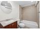 Updated bathroom offering tiled shower-tub, vanity with white sink at 2748 S Kenton Ct, Aurora, CO 80014