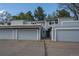 Inviting light blue townhouse with attached garages and well-maintained landscaping at 2748 S Kenton Ct, Aurora, CO 80014