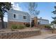 Well-maintained building exterior with a brick facade, blue siding, and professionally landscaped grounds at 2748 S Kenton Ct, Aurora, CO 80014