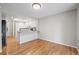 Kitchenette featuring a bar counter, wood floors, and modern appliances at 2748 S Kenton Ct, Aurora, CO 80014