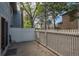 View of the outdoor patio with a white picket fence and access to the home's sliding glass door at 2748 S Kenton Ct, Aurora, CO 80014