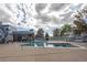 Outdoor pool area with comfortable lounge area and sparkling blue water on a sunny day at 2748 S Kenton Ct, Aurora, CO 80014