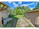 Side view of the backyard, showing lots of green space at 1930 Hoyt St, Lakewood, CO 80215