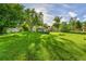 Large lot with mature trees and green lawn at 1930 Hoyt St, Lakewood, CO 80215