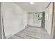 Bright bedroom features neutral tones, new laminate flooring, and great natural light at 1930 Hoyt St, Lakewood, CO 80215