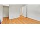 View of a bright bedroom featuring hardwood floors and closet space at 1930 Hoyt St, Lakewood, CO 80215