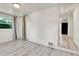 Hallway shows new flooring and natural light at 1930 Hoyt St, Lakewood, CO 80215