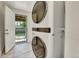 Laundry room featuring new stackable washer and dryer at 1930 Hoyt St, Lakewood, CO 80215