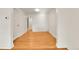 Living room featuring hardwood floors and a built-in closet at 1930 Hoyt St, Lakewood, CO 80215