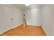 Living room featuring hardwood floors, a doorway, and ample natural light at 1930 Hoyt St, Lakewood, CO 80215