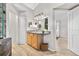 Well-lit bathroom with a vanity, modern lighting, and a glimpse into the adjacent bedroom space at 6001 S Yosemite St # H204, Greenwood Village, CO 80111