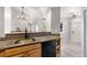 Well-lit kitchen features granite countertops, stainless steel sink, and modern black dishwasher at 6001 S Yosemite St # H204, Greenwood Village, CO 80111